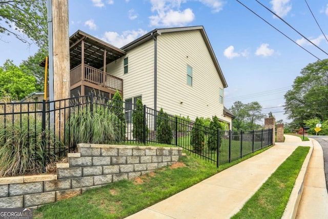 view of home's exterior with a balcony