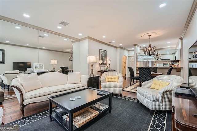 2499 Peachtree Rd Unit 108, Atlanta, GA 30305 - living room featuring a chandelier, crown molding, wood finished floors, and recessed lighting