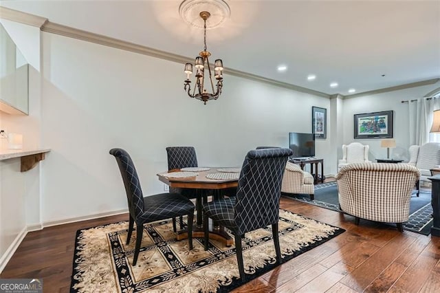 2499 Peachtree Rd Unit 108, Atlanta, GA 30305 - dining room with ornamental molding, dark wood-style floors, baseboards, a chandelier, and recessed lighting