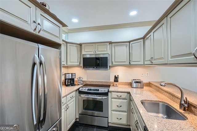 2499 Peachtree Rd Unit 108, Atlanta, GA 30305 - kitchen with stainless steel appliances, a sink, light stone countertops, ornamental molding, and recessed lighting