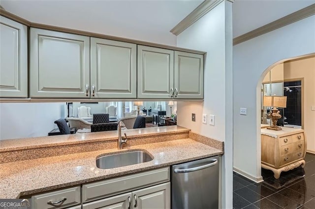 2499 Peachtree Rd Unit 108, Atlanta, GA 30305 - kitchen featuring stainless steel dishwasher, a sink, light stone countertops, arched walkways, and crown molding