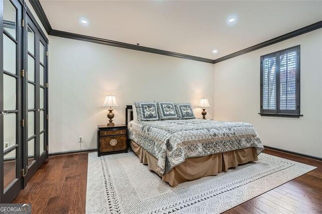 2499 Peachtree Rd Unit 108, Atlanta, GA 30305 - bedroom featuring crown molding, baseboards, hardwood / wood-style floors, and recessed lighting