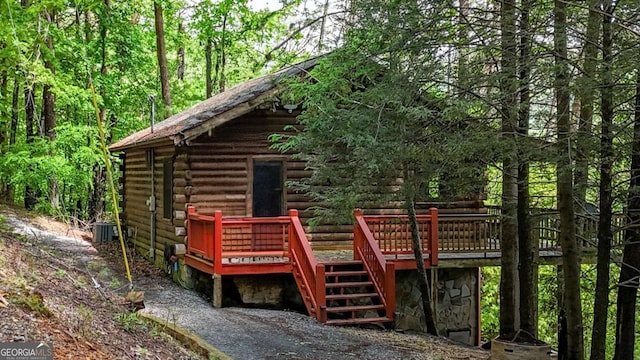 1157 Laurel Creek Rd, Blue Ridge, GA 30513 - view of front of home featuring log exterior, stairway, a deck, and central air condition unit