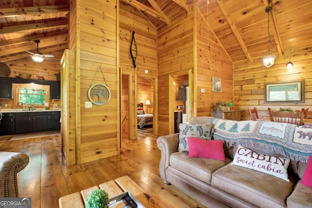 1157 Laurel Creek Rd, Blue Ridge, GA 30513 - living room with wooden ceiling, wood walls, light wood-style floors, beamed ceiling, and high vaulted ceiling