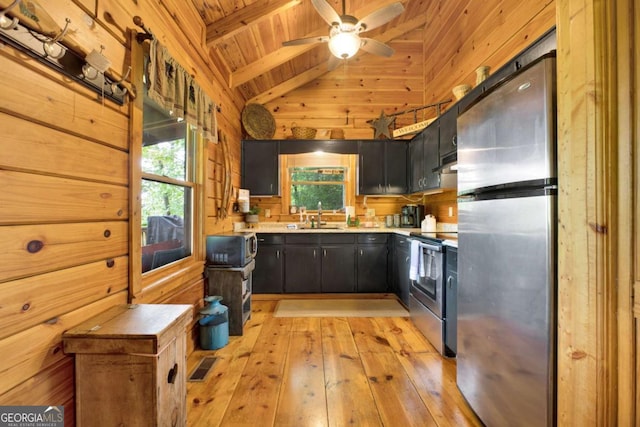 1157 Laurel Creek Rd, Blue Ridge, GA 30513 - kitchen featuring stainless steel appliances, wood ceiling, wooden walls, a sink, and light countertops