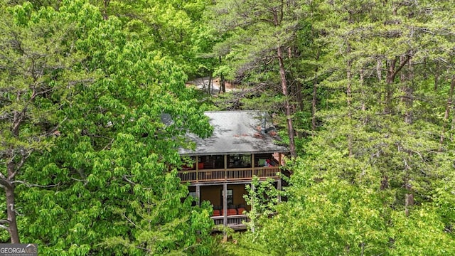 1157 Laurel Creek Rd, Blue Ridge, GA 30513 - rear view of house featuring a wooded view, a deck, and a balcony