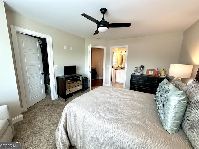 carpeted bedroom featuring baseboards and ceiling fan