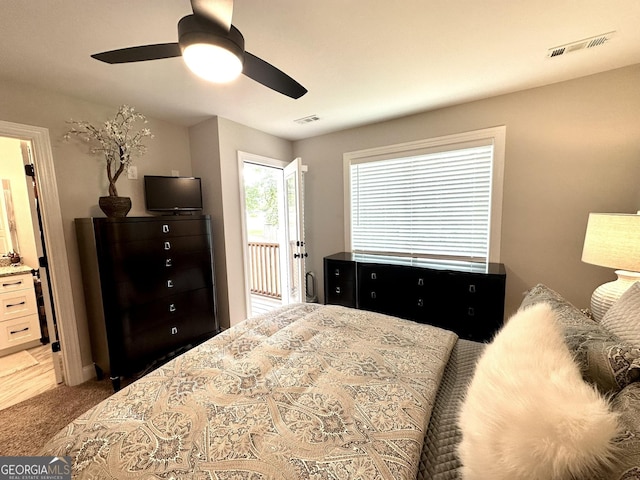 carpeted bedroom with ceiling fan