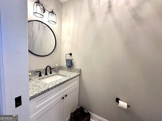 bathroom featuring vanity and baseboards