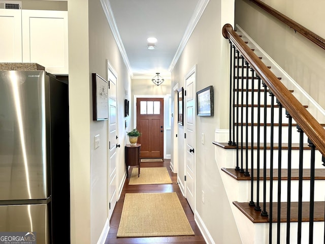 corridor with dark wood-style flooring, stairs, ornamental molding, and baseboards
