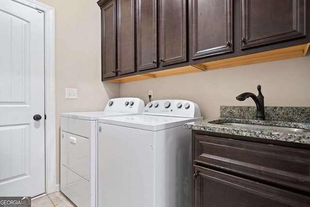 161 Archstone Sq, Mcdonough, GA 30253 - washroom with washing machine and clothes dryer, cabinet space, and light tile patterned flooring