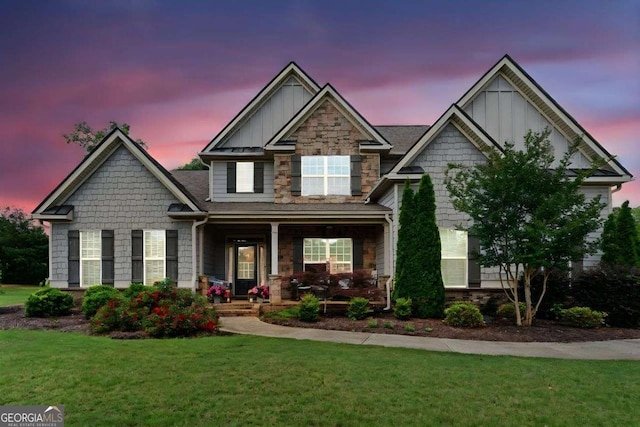 161 Archstone Sq, Mcdonough, GA 30253 - craftsman-style house featuring a porch, a yard, board and batten siding, and stone siding