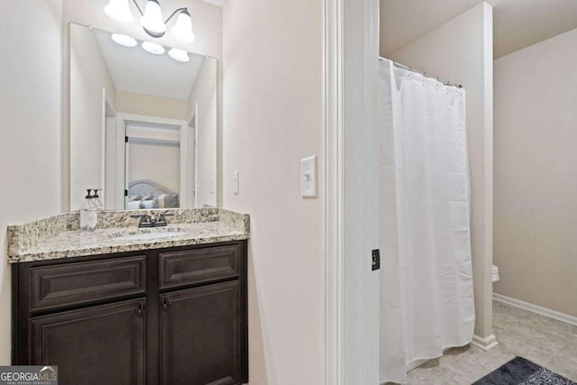 161 Archstone Sq, Mcdonough, GA 30253 - full bathroom featuring vanity, toilet, baseboards, and tile patterned floors