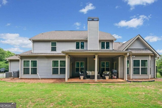 161 Archstone Sq, Mcdonough, GA 30253 - back of house with a ceiling fan, an outdoor hangout area, a patio area, a chimney, and central AC unit
