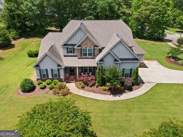 161 Archstone Sq, Mcdonough, GA 30253 - craftsman-style house featuring board and batten siding, a front lawn, stone siding, and a shingled roof
