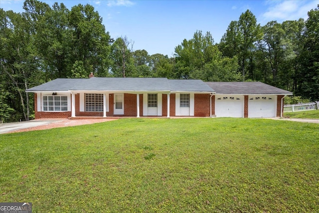 684 Hog Liver Rd, Carrollton, GA 30117 - ranch-style house featuring an attached garage, brick siding, and driveway