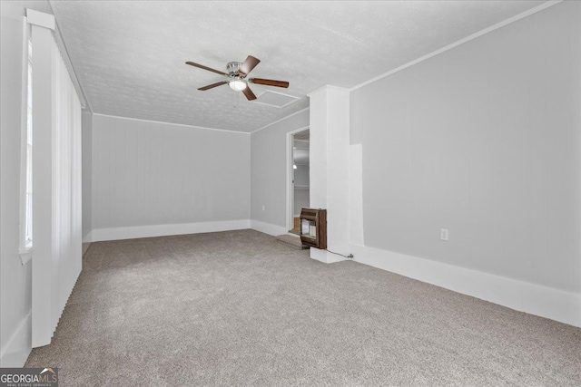 684 Hog Liver Rd, Carrollton, GA 30117 - unfurnished living room featuring carpet, a ceiling fan, a textured ceiling, baseboards, and ornamental molding