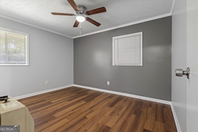 684 Hog Liver Rd, Carrollton, GA 30117 - spare room featuring dark wood-type flooring, baseboards, a ceiling fan, and crown molding