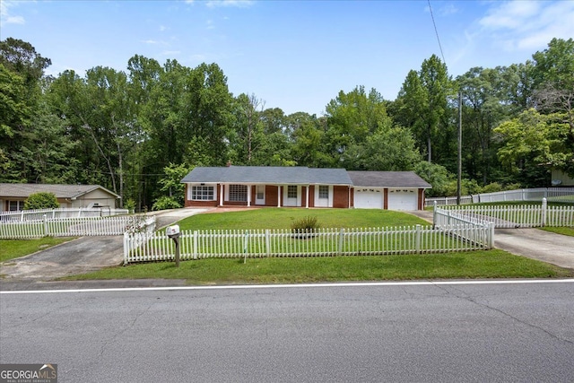 684 Hog Liver Rd, Carrollton, GA 30117 - ranch-style home with asphalt driveway, brick siding, a porch, and a garage