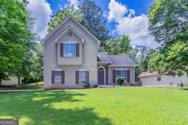 12241 Cypress Way, Fayetteville, GA 30215 - view of front facade with stucco siding, cooling unit, and a front yard