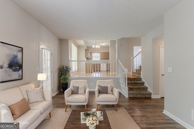 12241 Cypress Way, Fayetteville, GA 30215 - living area featuring a chandelier, wood finished floors, baseboards, and stairs