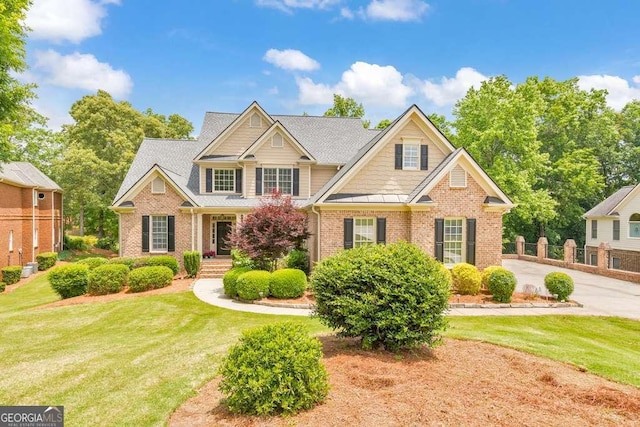 craftsman house with brick siding