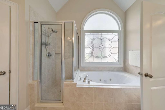 full bath with a shower stall, a whirlpool tub, and lofted ceiling