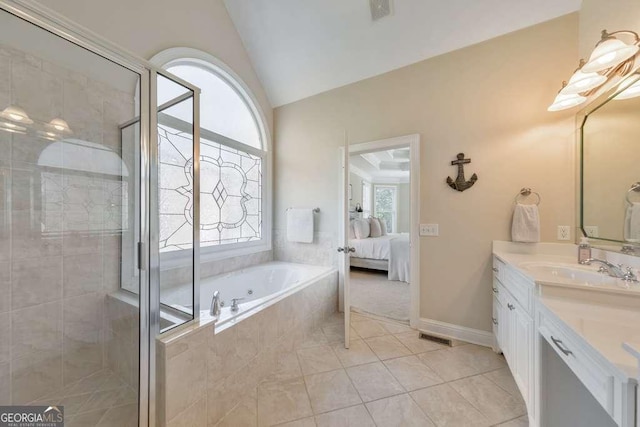 bathroom featuring a garden tub, lofted ceiling, vanity, tile patterned flooring, and a stall shower