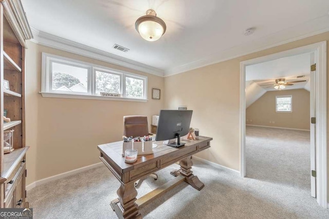 office space with light carpet, a ceiling fan, baseboards, and crown molding