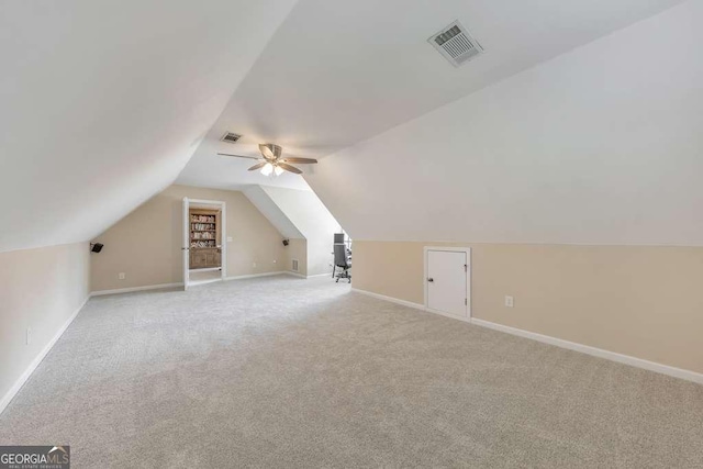 bonus room with carpet flooring, baseboards, lofted ceiling, and ceiling fan