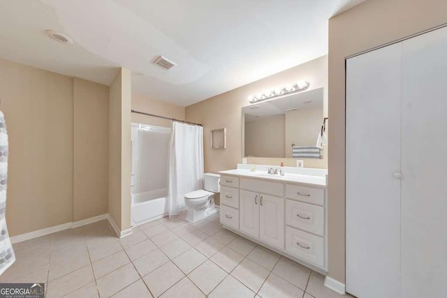 bathroom featuring tile patterned floors, toilet, vanity, shower / bath combination with curtain, and baseboards