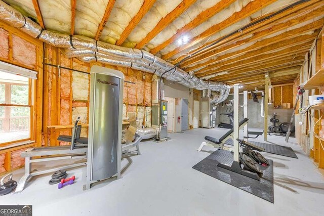 workout area featuring heating unit