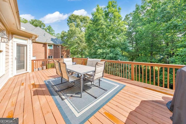 wooden deck with outdoor dining space