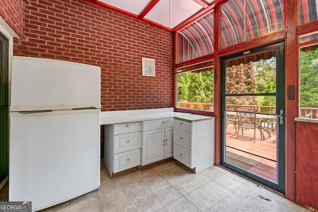 11569 Finley Rd, Johns Creek, GA 30024 - unfurnished sunroom featuring plenty of natural light and vaulted ceiling