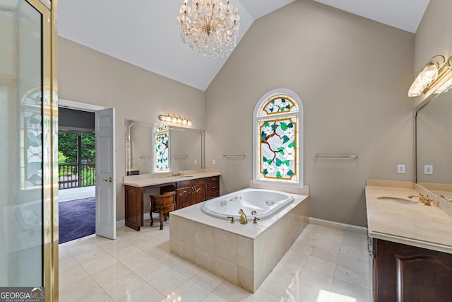 11569 Finley Rd, Johns Creek, GA 30024 - full bath with high vaulted ceiling, two vanities, a garden tub, tile patterned floors, and baseboards