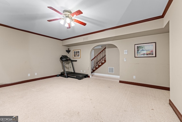 11569 Finley Rd, Johns Creek, GA 30024 - exercise area featuring arched walkways, crown molding, ceiling fan, carpet flooring, and baseboards