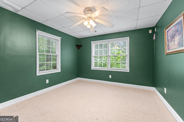 11569 Finley Rd, Johns Creek, GA 30024 - carpeted spare room featuring a paneled ceiling, a ceiling fan, and baseboards