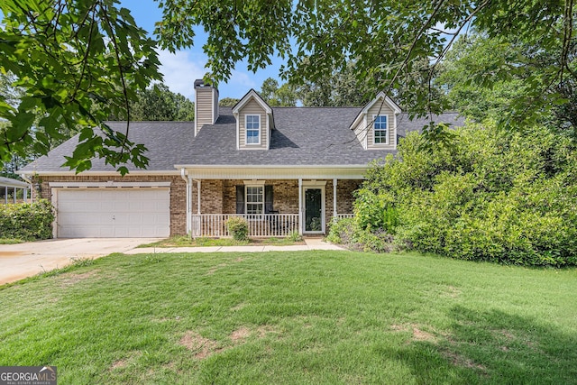 220 Windpher Rdg, Hampton, GA 30228 - cape cod-style house featuring covered porch, an attached garage, a front yard, concrete driveway, and a shingled roof