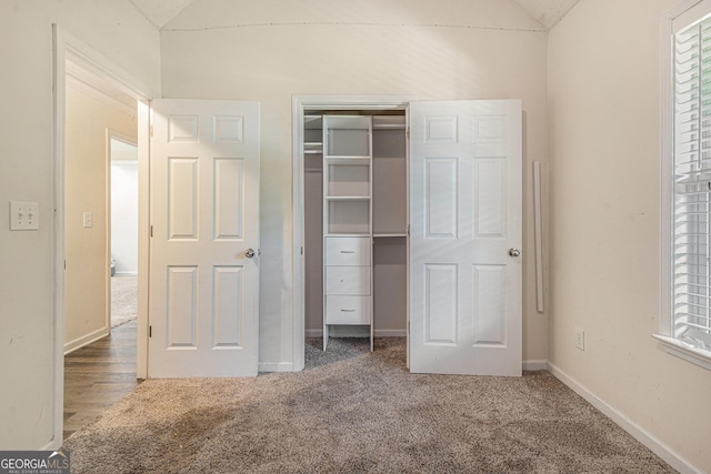 220 Windpher Rdg, Hampton, GA 30228 - unfurnished bedroom featuring lofted ceiling, carpet floors, baseboards, and a closet