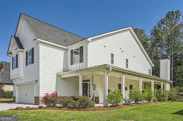 837 Brown Thrasher Way, Bremen, GA 30110 - view of front of property featuring a porch, an attached garage, a front yard, concrete driveway, and a chimney