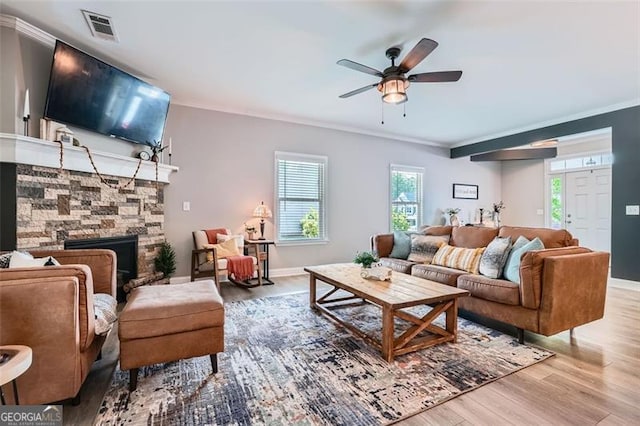 837 Brown Thrasher Way, Bremen, GA 30110 - living room featuring wood finished floors, ornamental molding, a fireplace, ceiling fan, and baseboards