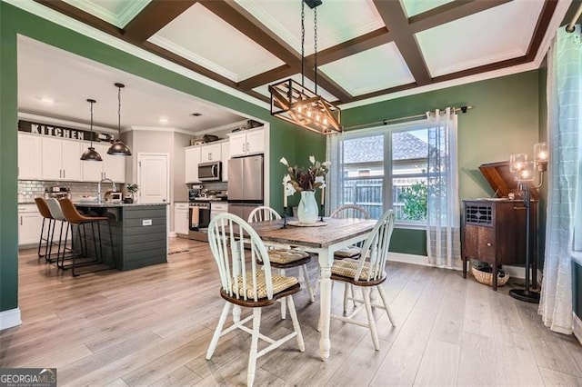 837 Brown Thrasher Way, Bremen, GA 30110 - dining room featuring ornamental molding, coffered ceiling, light wood finished floors, a chandelier, and beam ceiling