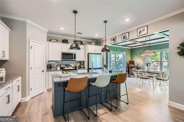 837 Brown Thrasher Way, Bremen, GA 30110 - kitchen with stainless steel appliances, white cabinetry, crown molding, decorative backsplash, and hanging light fixtures