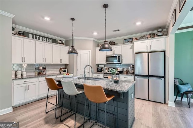 837 Brown Thrasher Way, Bremen, GA 30110 - kitchen with stainless steel appliances, a sink, tasteful backsplash, white cabinetry, and recessed lighting