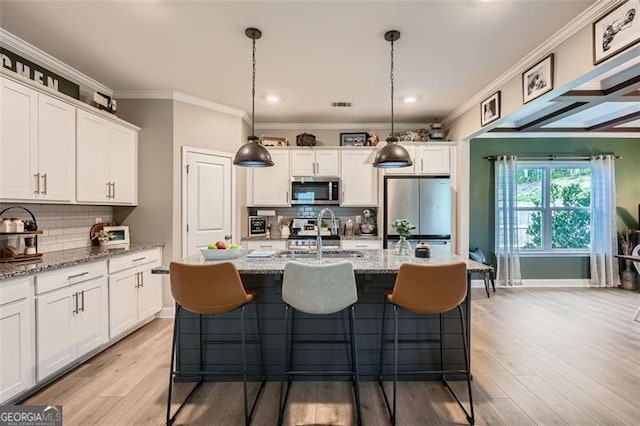 837 Brown Thrasher Way, Bremen, GA 30110 - kitchen with appliances with stainless steel finishes, a sink, ornamental molding, white cabinets, and decorative backsplash