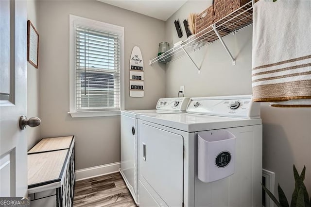 837 Brown Thrasher Way, Bremen, GA 30110 - laundry room with washer and dryer, baseboards, and wood finished floors