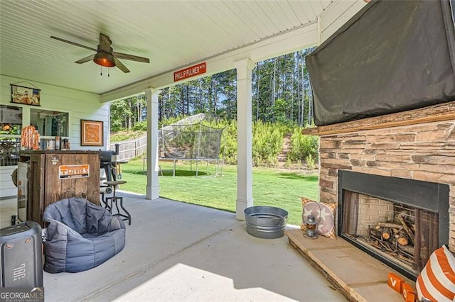 837 Brown Thrasher Way, Bremen, GA 30110 - view of patio with an outdoor stone fireplace, a trampoline, and a ceiling fan