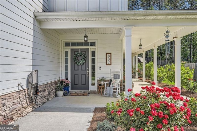 837 Brown Thrasher Way, Bremen, GA 30110 - property entrance featuring covered porch and board and batten siding