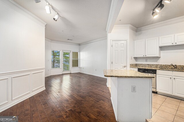 1850 Cotillion Dr Unit 4218, Atlanta, GA 30338 - kitchen with track lighting, stainless steel dishwasher, a sink, ornamental molding, and stone countertops