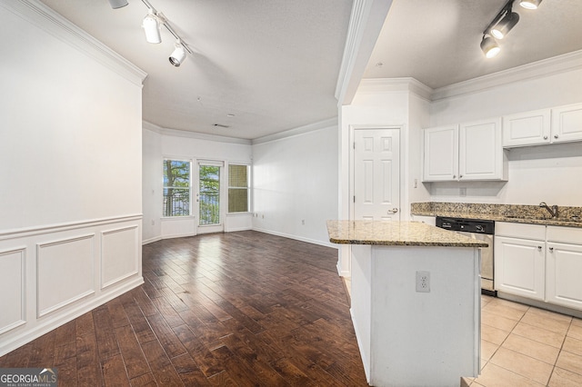 1850 Cotillion Dr Unit 4218, Atlanta, GA 30338 - kitchen with dishwasher, track lighting, crown molding, stone counters, and white cabinets